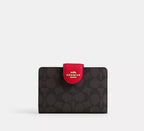 Coach Medium Corner Zip Wallet in signature canvas